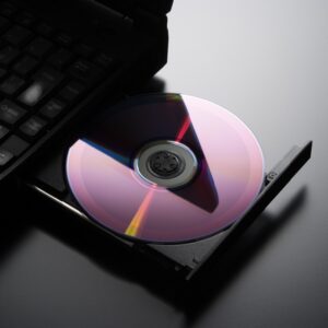 Inserting a CD into a laptop computer with copy space